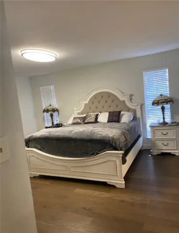 a bedroom with a bed and a lamp