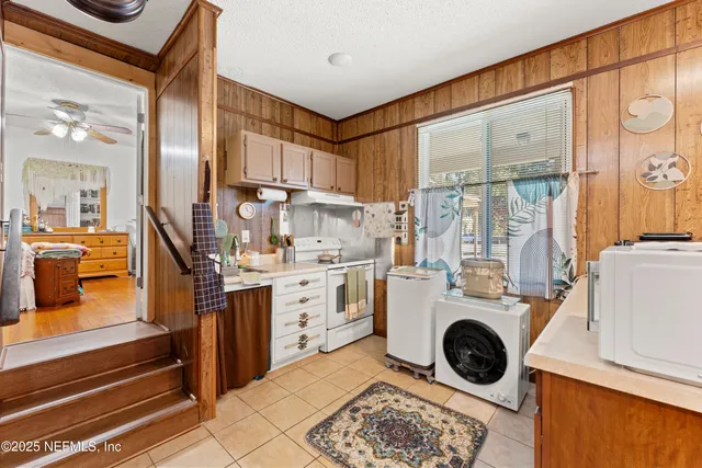 a bedroom with bed and furniture