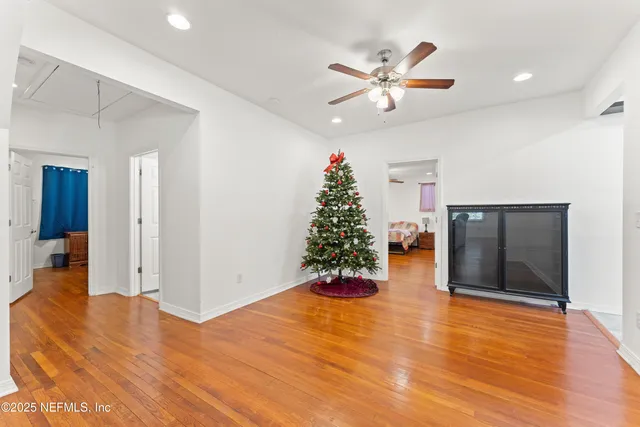 a view of a livingroom with wooden floor