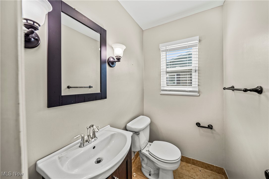 1796 Lander Road Mayfield Heights, OH 44124 - Photo 15 of 39 Bathroom with vanity, tile patterned flooring, and toilet