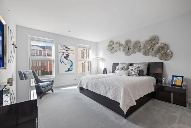 a bedroom with a bed and a table in it