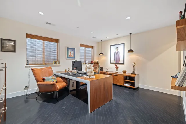 a view of a workspace with furniture window and wooden floor