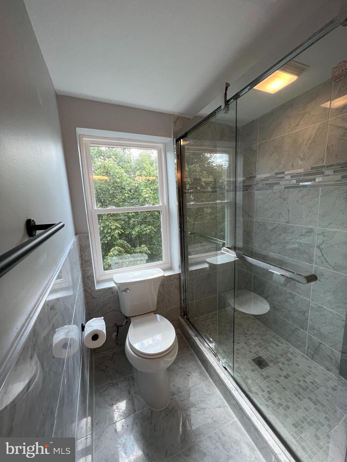 1939 Mt Vernon Street, Unit 3 Philadelphia, PA 19130 - Photo 12 of 17 a bathroom with a toilet and a shower