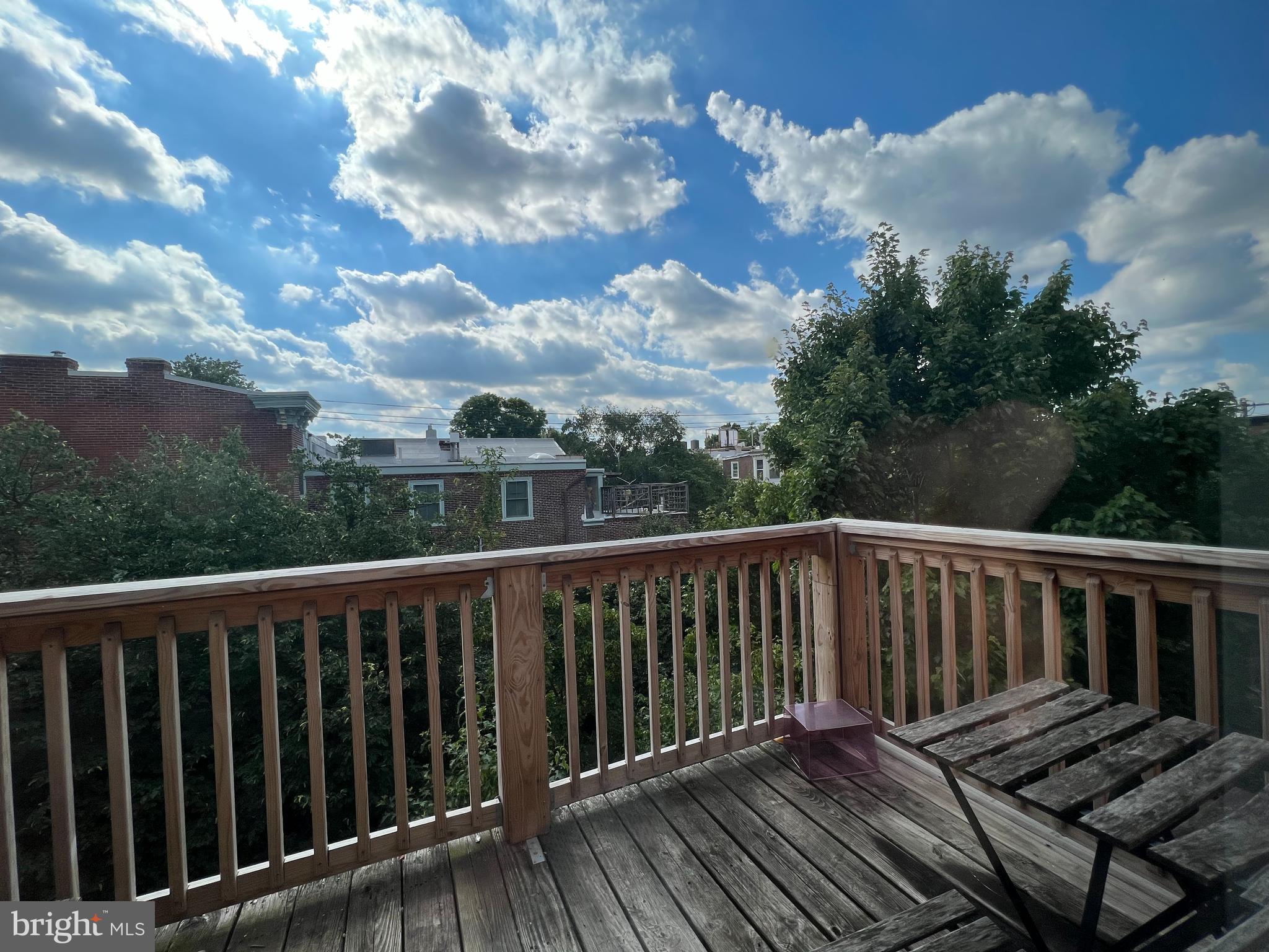 1939 Mt Vernon Street, Unit 3 Philadelphia, PA 19130 - Photo 17 of 17 a balcony with wooden floor and fence
