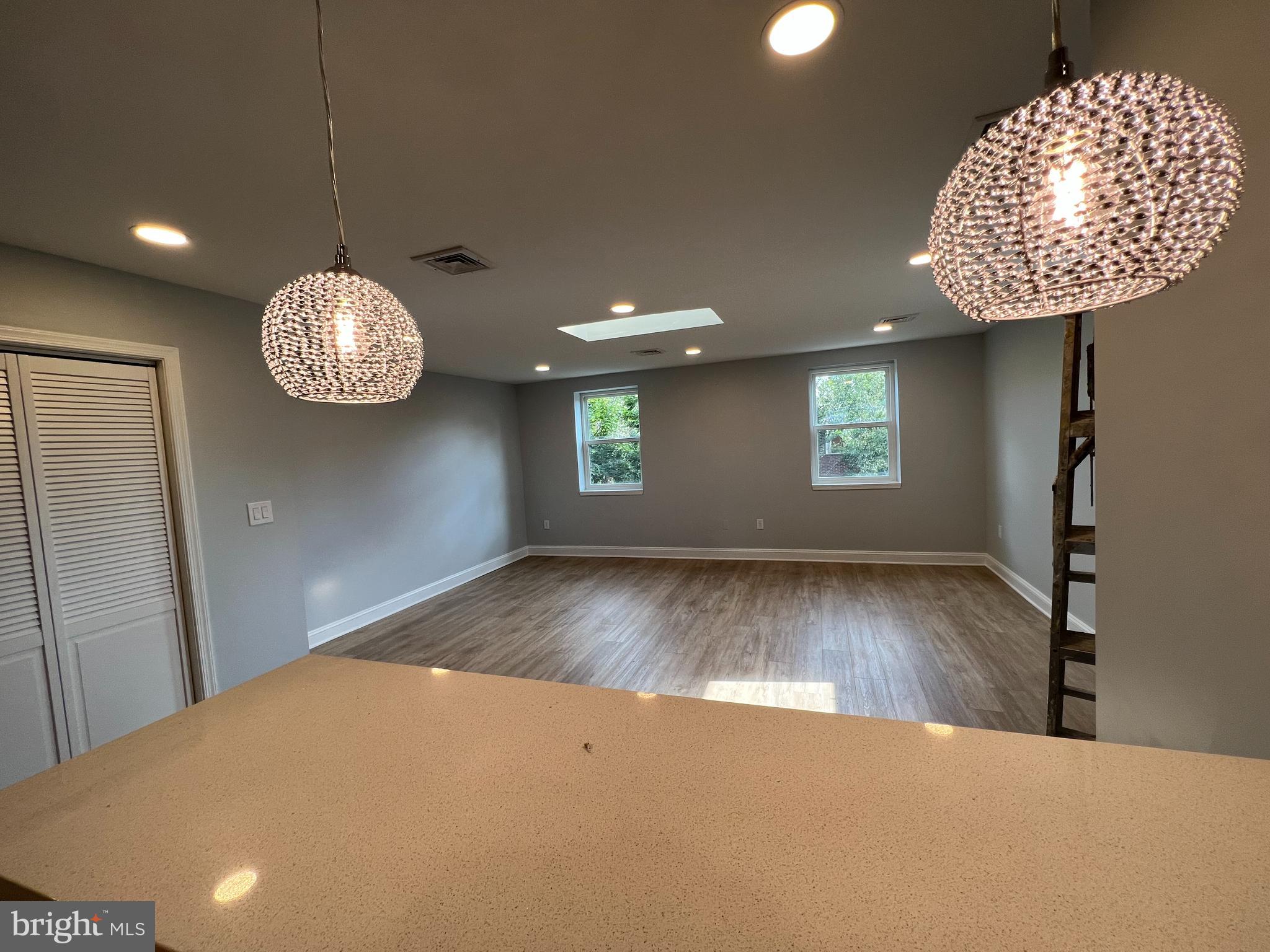 1939 Mt Vernon Street, Unit 3 Philadelphia, PA 19130 - Photo 4 of 17 a view of an empty room with a window and wooden floor