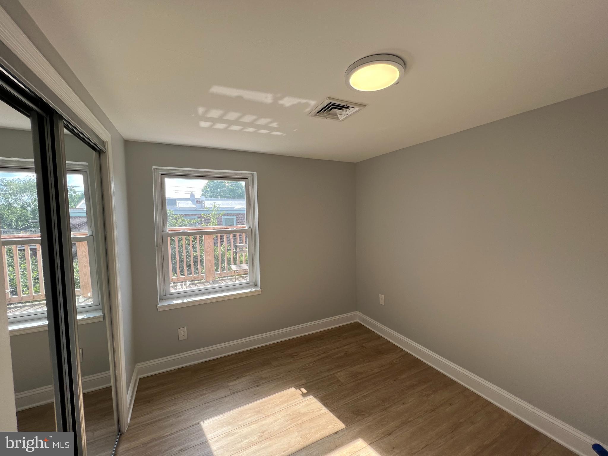 1939 Mt Vernon Street, Unit 3 Philadelphia, PA 19130 - Photo 9 of 17 a view of empty room with wooden floor and fan