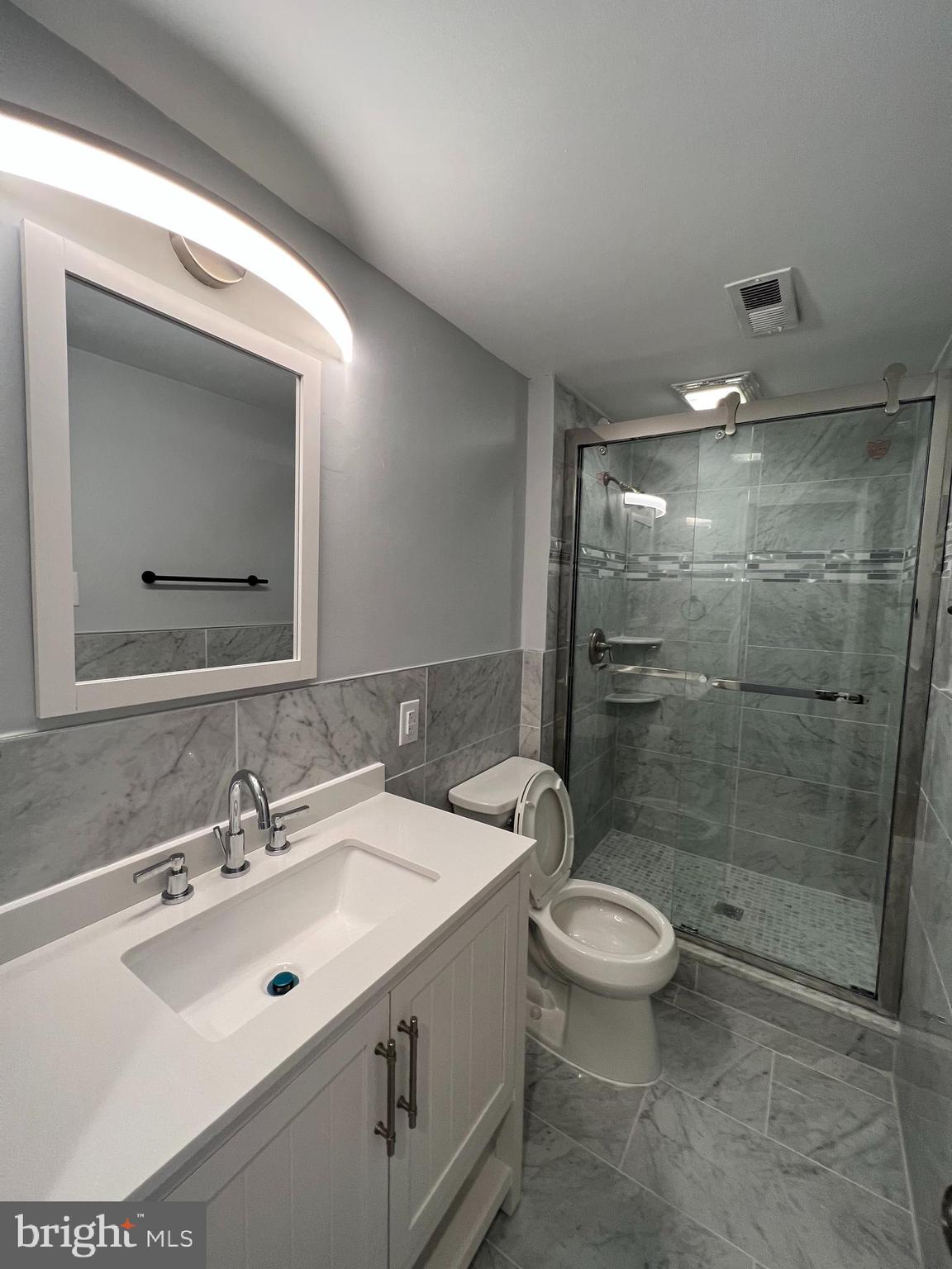 1939 Mt Vernon Street, Unit 3 Philadelphia, PA 19130 - Photo 10 of 17 a bathroom with a sink toilet and shower
