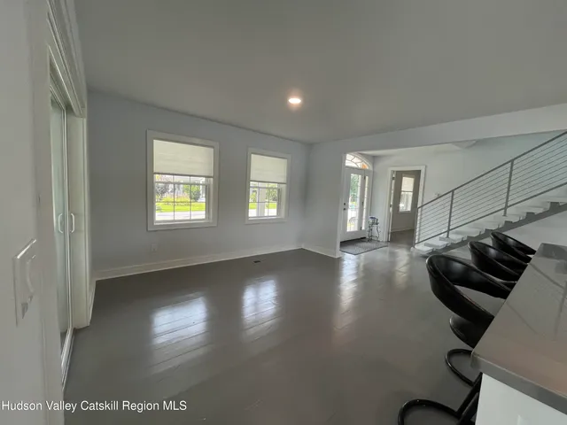 a view of a livingroom with furniture and wooden floor