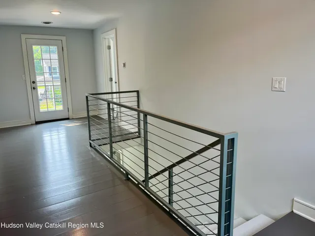 a view of entryway with wooden floor