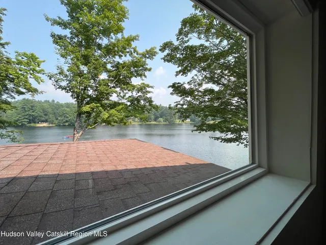 a wooden bench sitting in front of a building