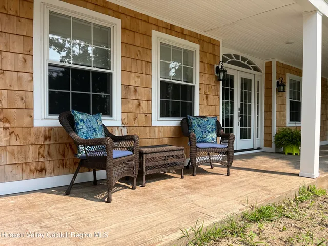 a building outdoor space with a couch and a potted plant