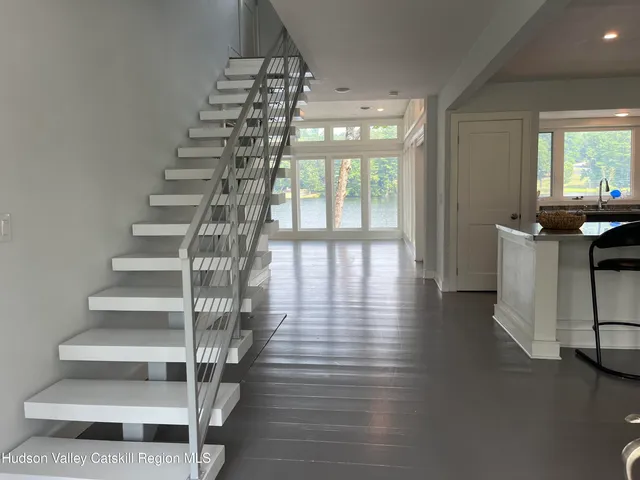 a view of entryway with livingroom and wooden floor