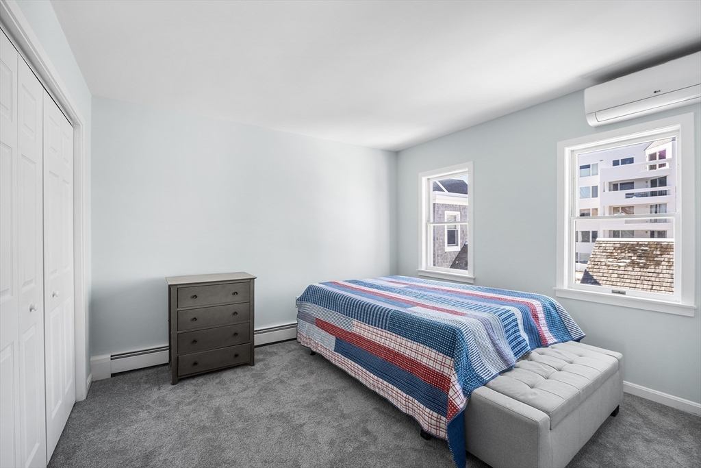 30 Commodore Court, Unit 30 Hull, MA 02045 - Photo 21 of 42 a bedroom with a bed and a window