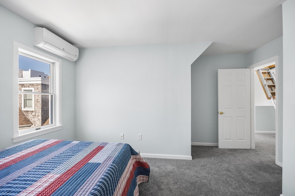 30 Commodore Court, Unit 30 Hull, MA 02045 - Photo 22 of 42 a bedroom with a bed and a window