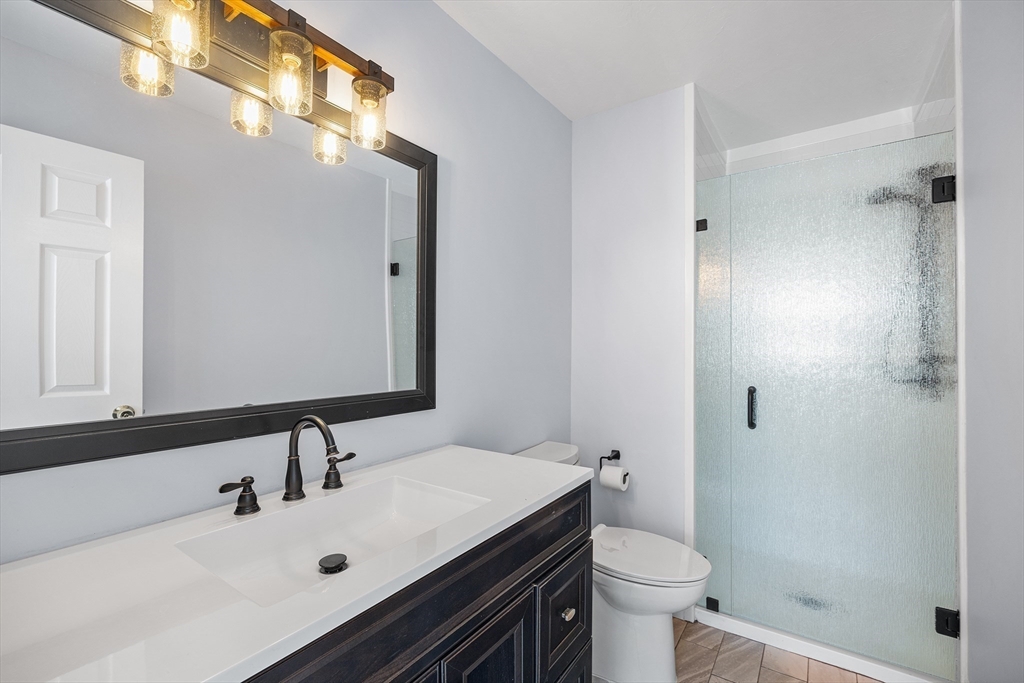 30 Commodore Court, Unit 30 Hull, MA 02045 - Photo 23 of 42 a bathroom with a sink toilet and shower