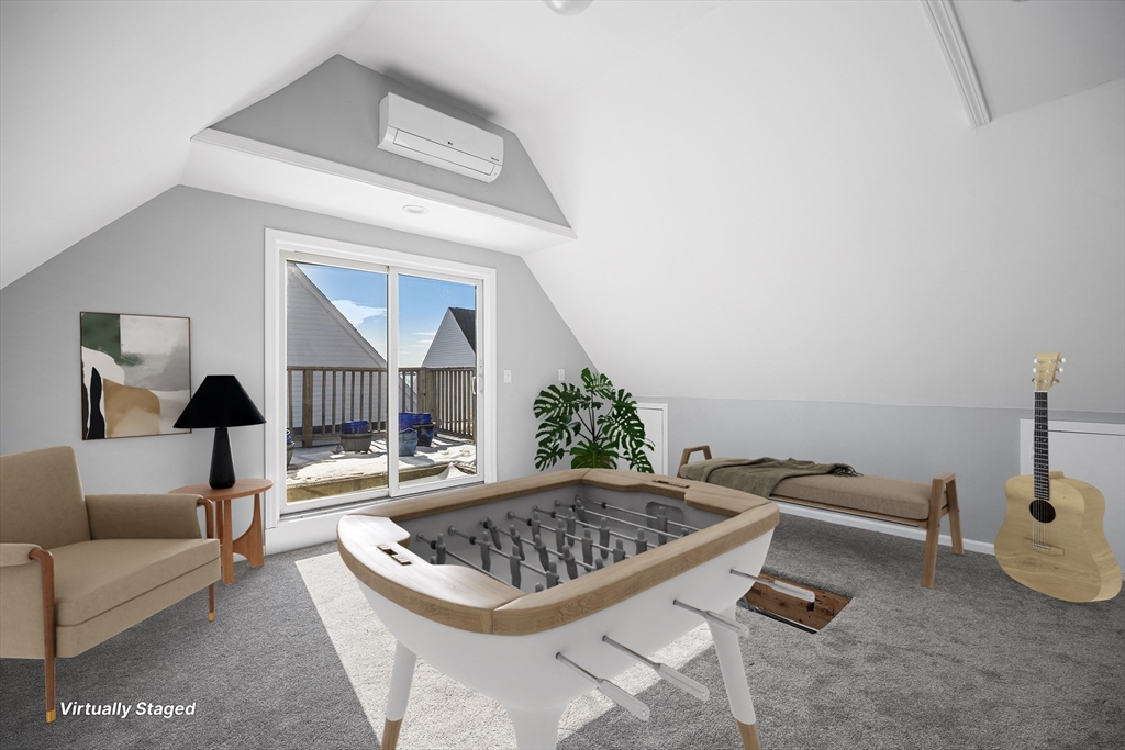 30 Commodore Court, Unit 30 Hull, MA 02045 - Photo 24 of 42 a living room with furniture and a fireplace