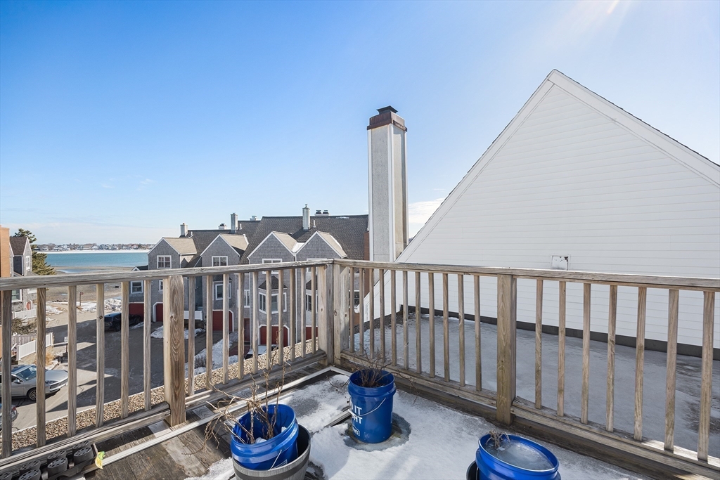 30 Commodore Court, Unit 30 Hull, MA 02045 - Photo 26 of 42 a view of a deck with wooden floor and fence