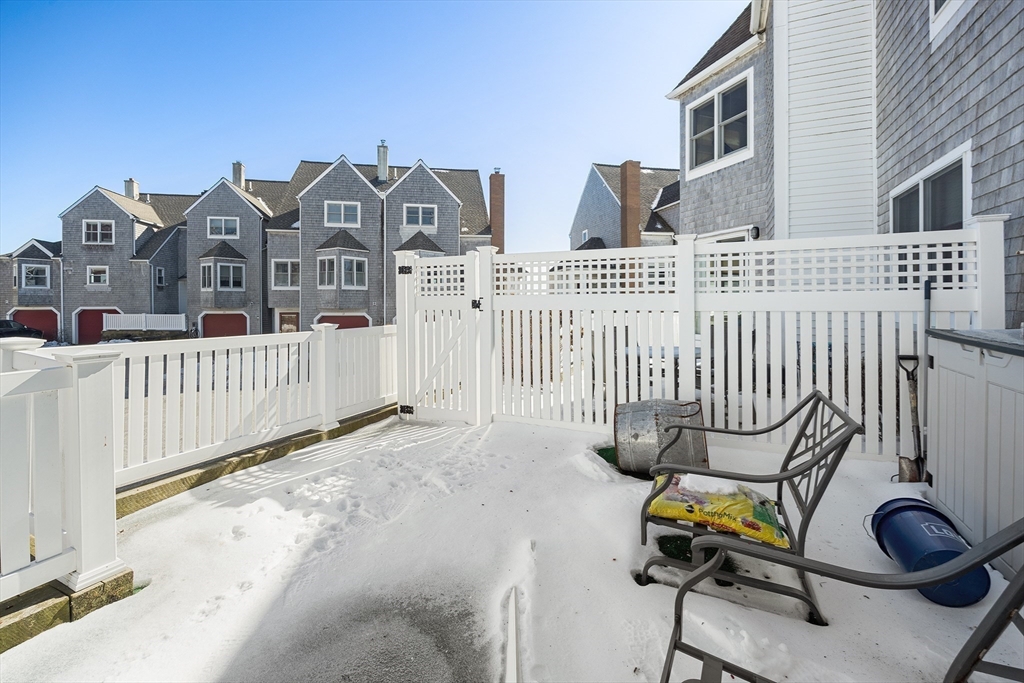 30 Commodore Court, Unit 30 Hull, MA 02045 - Photo 29 of 42 a view of a house with wooden fence