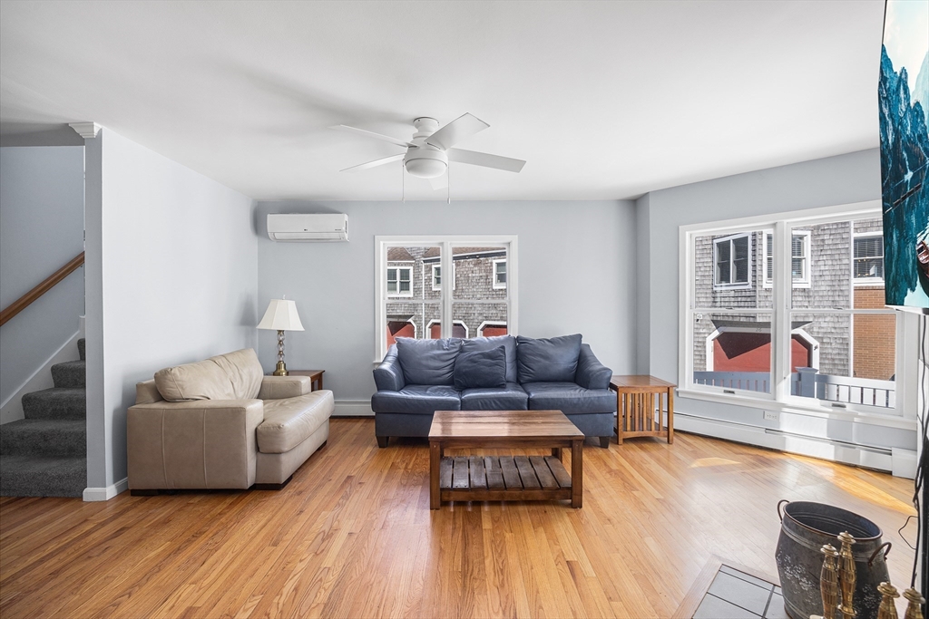 30 Commodore Court, Unit 30 Hull, MA 02045 - Photo 4 of 42 a living room with furniture and a wooden floor