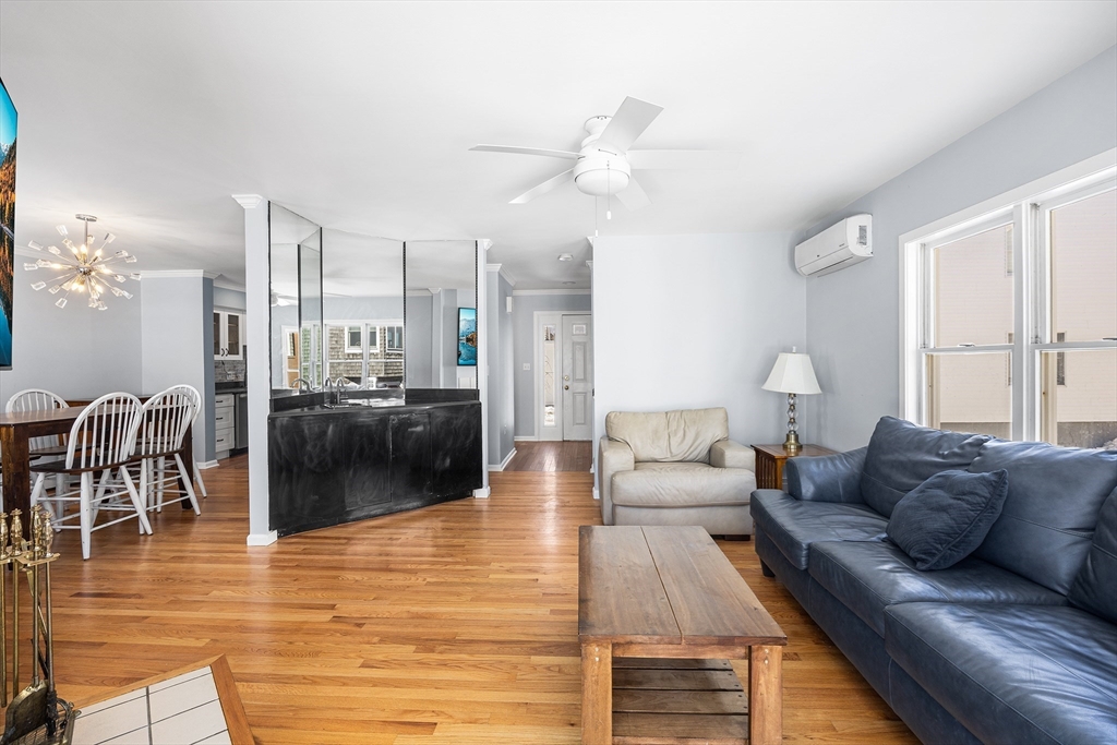 30 Commodore Court, Unit 30 Hull, MA 02045 - Photo 5 of 42 a living room with furniture and a wooden floor