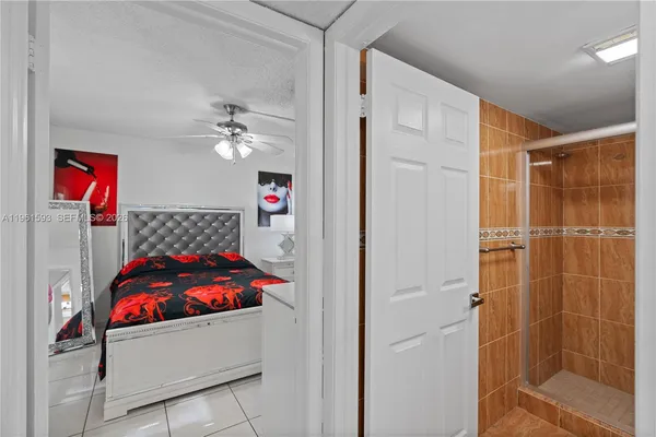 a bathroom with a shower and a sink