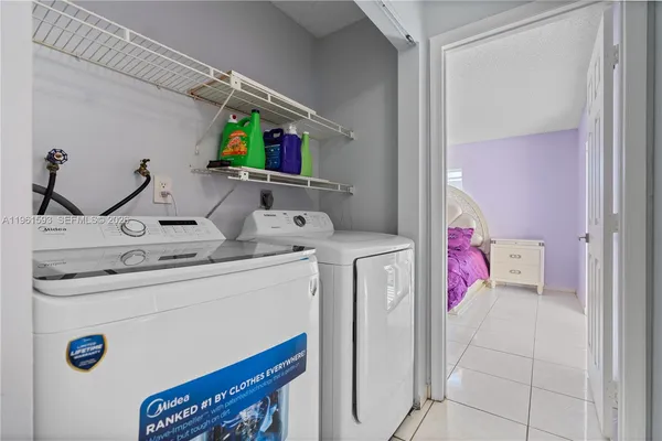 a utility room with dryer and washer