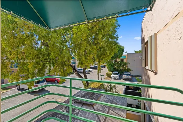 a view of a balcony with chairs