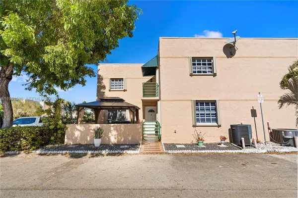 a front view of a building with a street