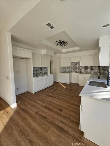 a view of a kitchen with a sink and a stove