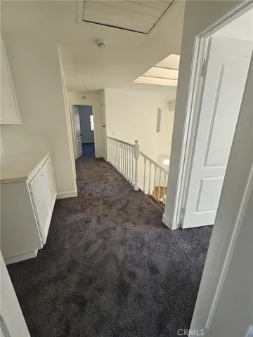 a view of a hallway view with staircase