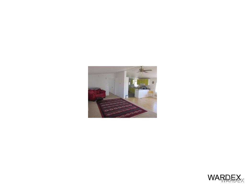 3936 Tonto Road Golden Valley, AZ 86413 - Photo 2 of 29 a living room with a couch