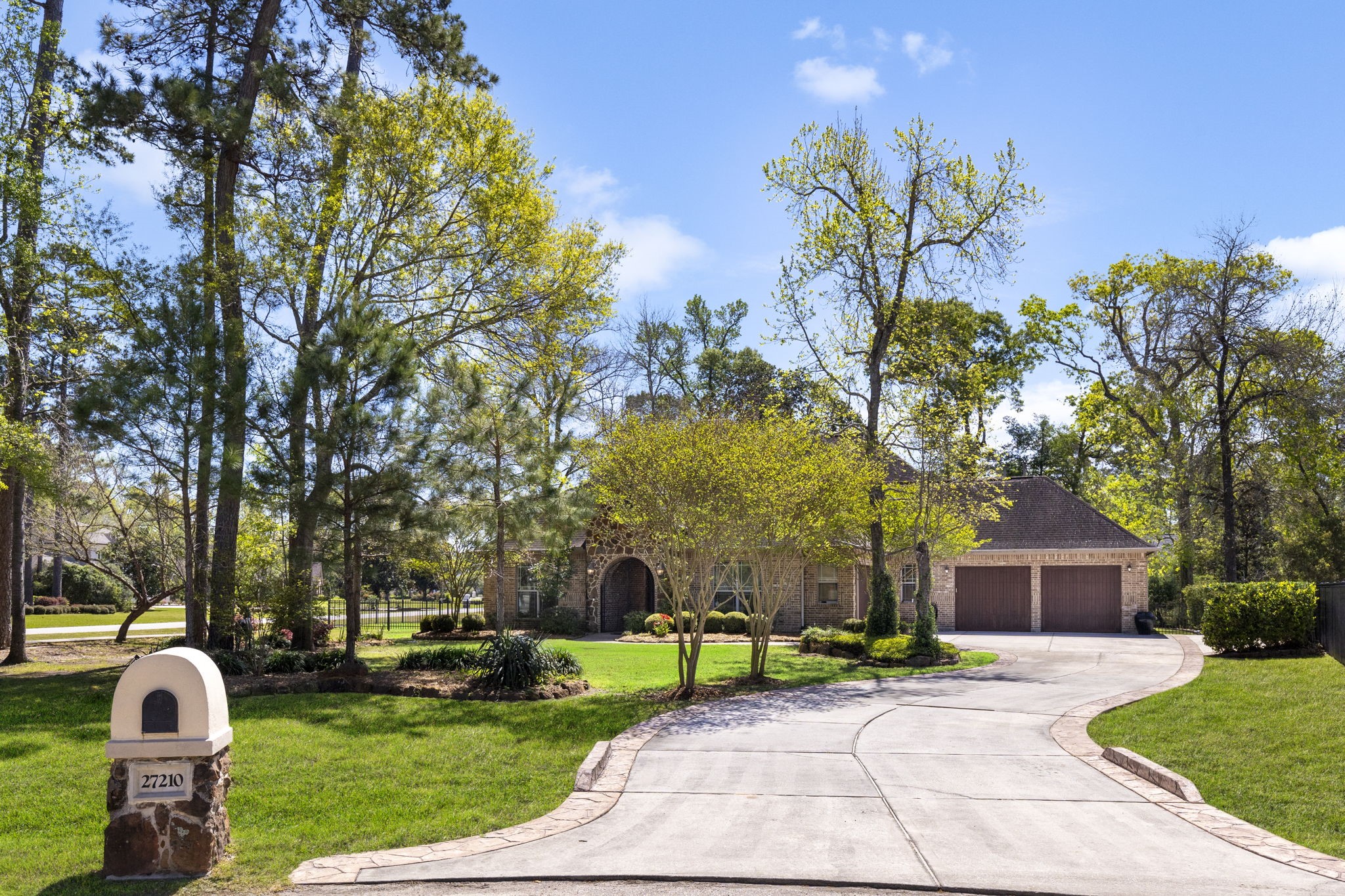 27210 Cass Court Spring, TX 77386 - Photo 2 of 49 a front view of a house with a yard and garage