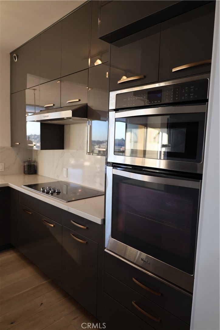 222 Monterey Road, Unit 1603 Glendale, CA 91206 - Photo 11 of 38 a kitchen with a stove and a microwave