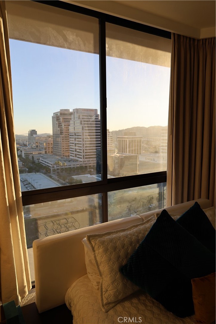 222 Monterey Road, Unit 1603 Glendale, CA 91206 - Photo 21 of 38 a view of a living room with furniture and a floor to ceiling window