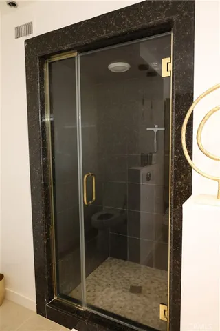 a bathroom with a sink toilet and a mirror