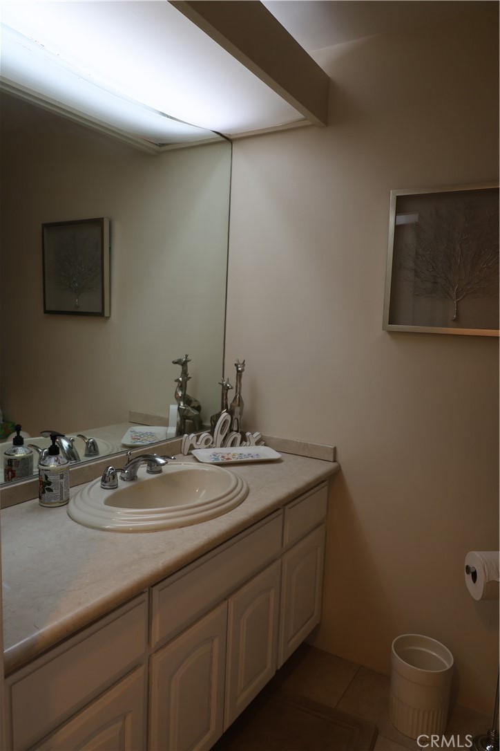 222 Monterey Road, Unit 1603 Glendale, CA 91206 - Photo 25 of 38 a bathroom with a sink toilet and a mirror
