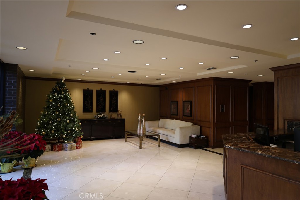 222 Monterey Road, Unit 1603 Glendale, CA 91206 - Photo 29 of 38 a living room with furniture gym equipment and potted plants