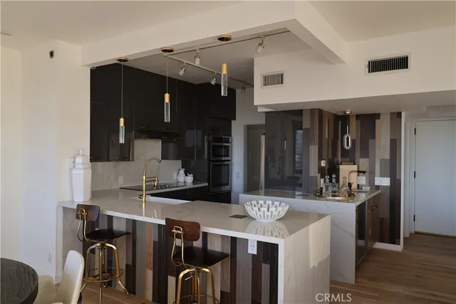 a kitchen with a sink and cabinets
