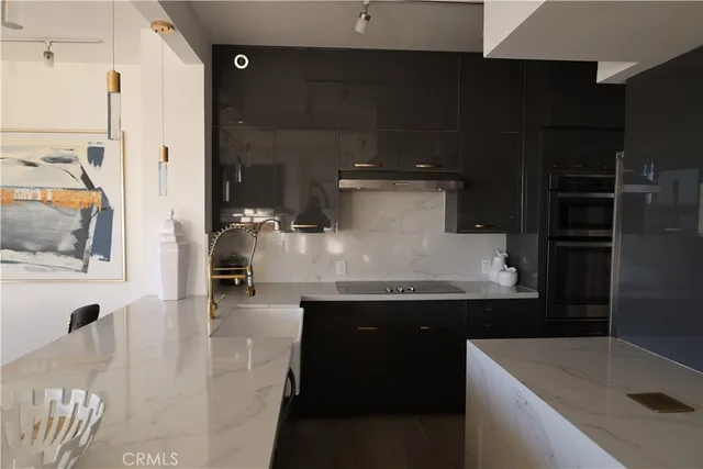 a kitchen with a refrigerator and a sink