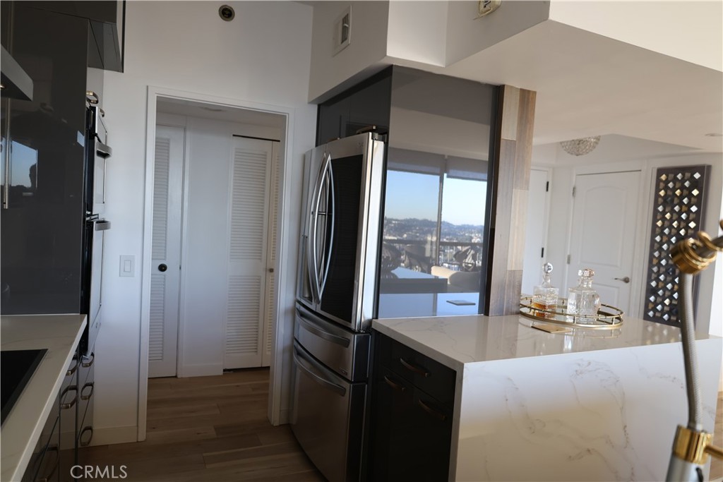 222 Monterey Road, Unit 1603 Glendale, CA 91206 - Photo 9 of 38 a kitchen with a refrigerator and a sink