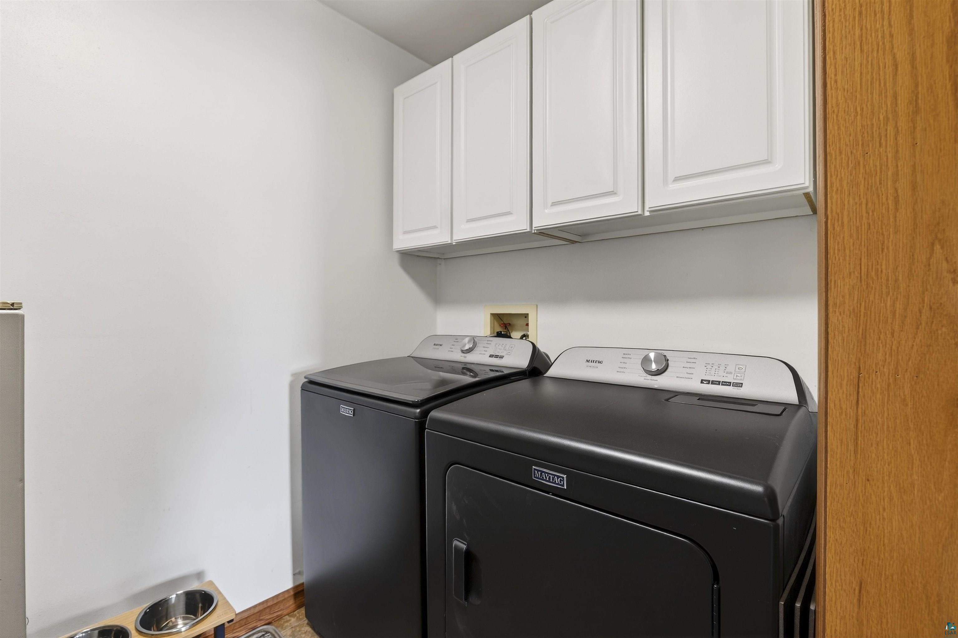11702 East Mail Road Gordon, WI 54838 - Photo 38 of 43 Laundry room with cabinet space and washer and clothes dryer