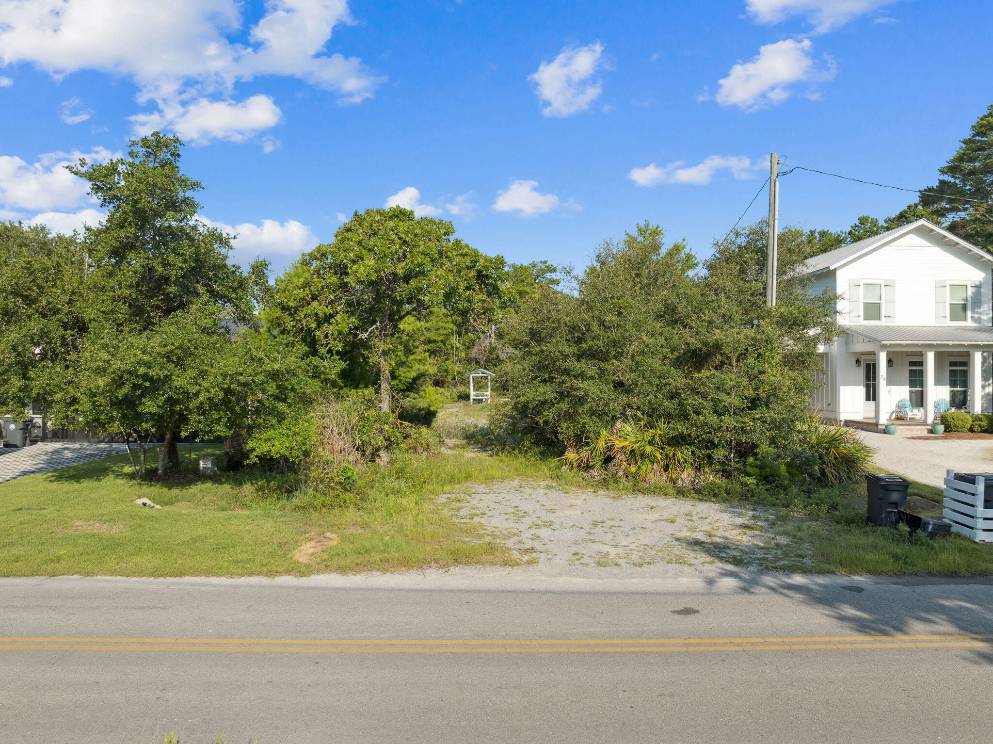 86 South Gulf Drive Santa Rosa Beach, FL 32459 - Photo 6 of 8 a view of a house with a yard