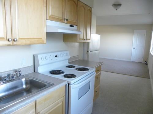 445 Esplanade Avenue, Unit 2 Pacifica, CA 94044 - Photo 6 of 10 a kitchen with a sink cabinets and appliances