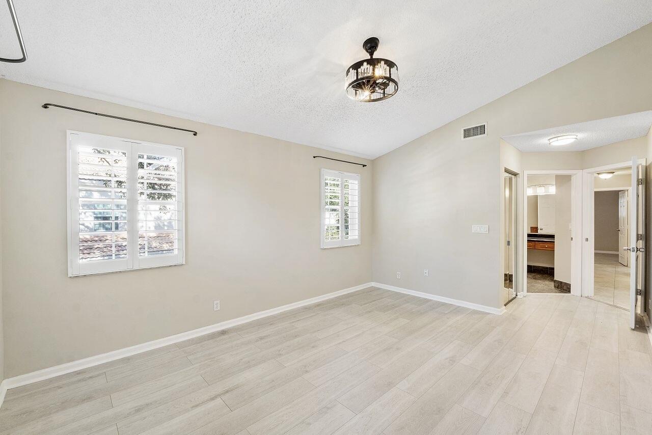 17270 Boca Club Boulevard, Unit 1707 Boca Raton, FL 33487 - Photo 20 of 68 a view of an empty room with a window