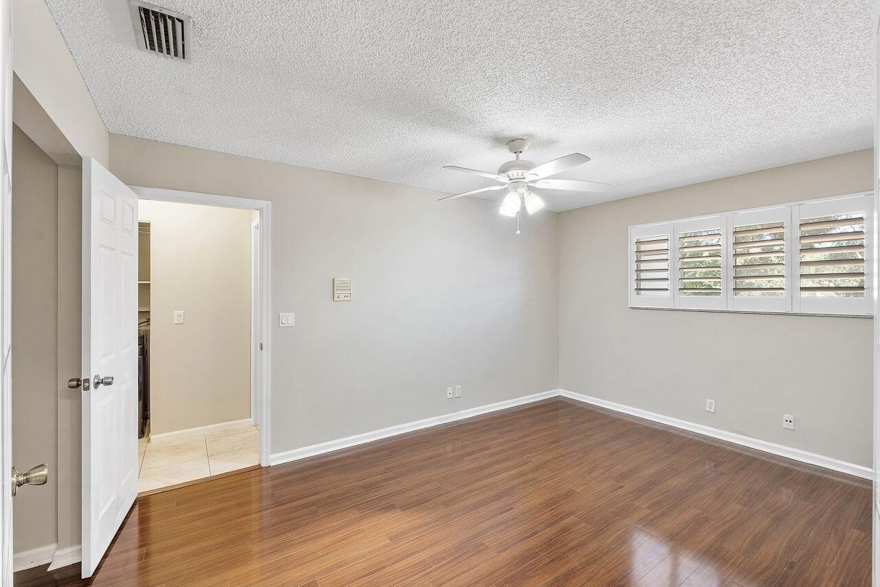 17270 Boca Club Boulevard, Unit 1707 Boca Raton, FL 33487 - Photo 28 of 68 a view of an empty room with wooden floor
