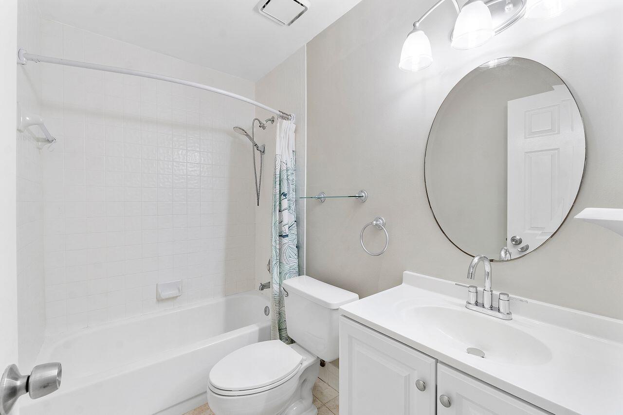 17270 Boca Club Boulevard, Unit 1707 Boca Raton, FL 33487 - Photo 31 of 68 a bathroom with a sink toilet and shower