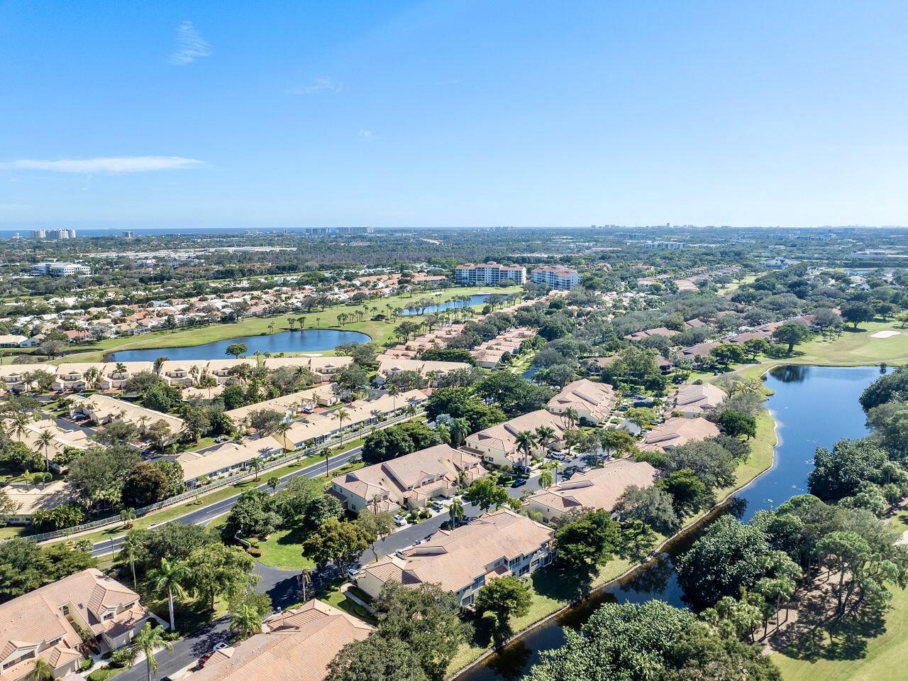 17270 Boca Club Boulevard, Unit 1707 Boca Raton, FL 33487 - Photo 46 of 68 an aerial view of a city with lots of residential buildings and ocean view in back