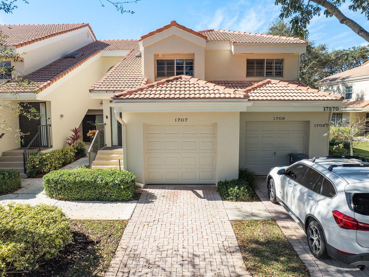 17270 Boca Club Boulevard, Unit 1707 Boca Raton, FL 33487 - Photo 48 of 68 a front view of a house with garden