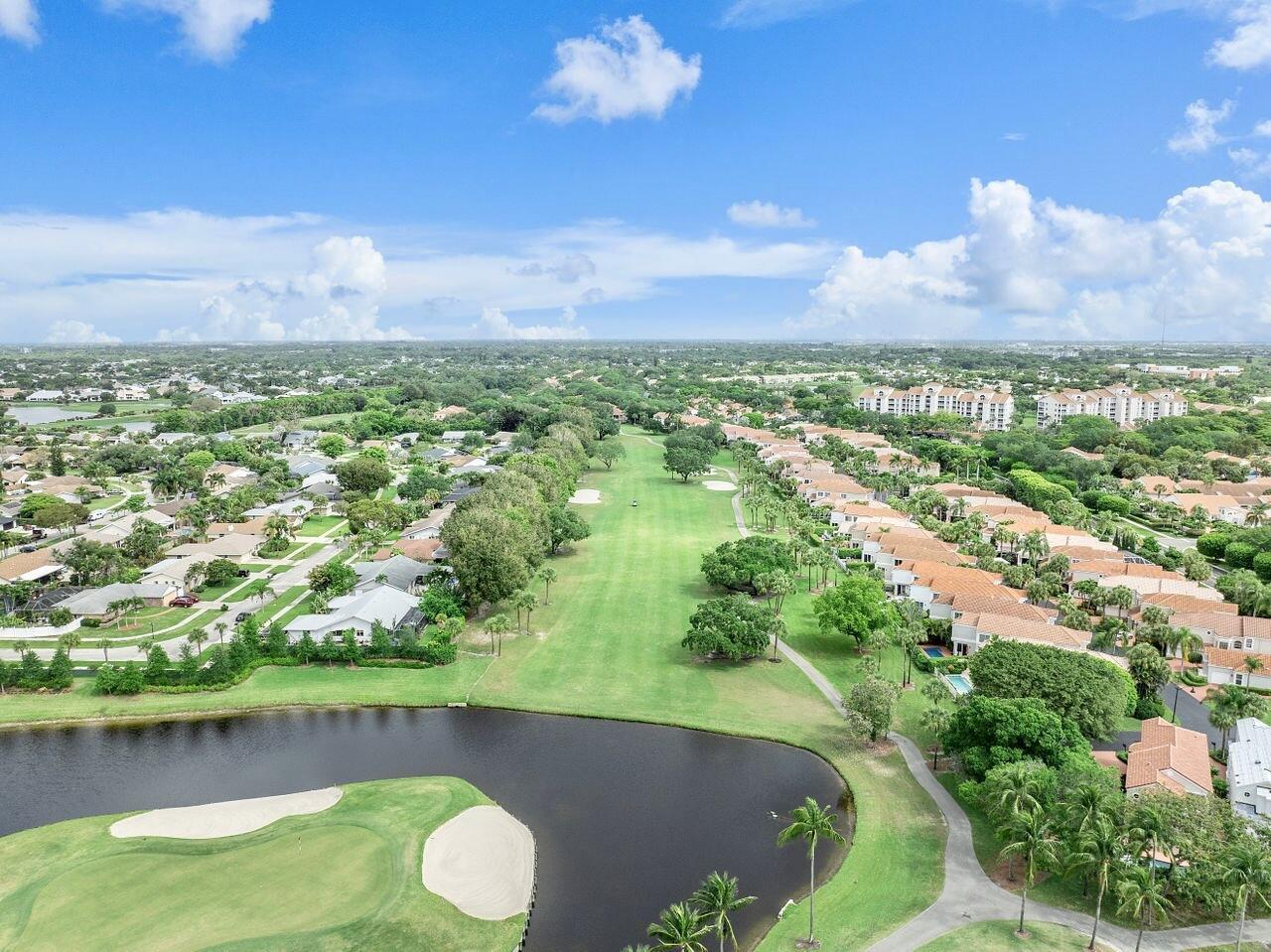 17270 Boca Club Boulevard, Unit 1707 Boca Raton, FL 33487 - Photo 52 of 68 an aerial view of residential houses with outdoor space and swimming pool