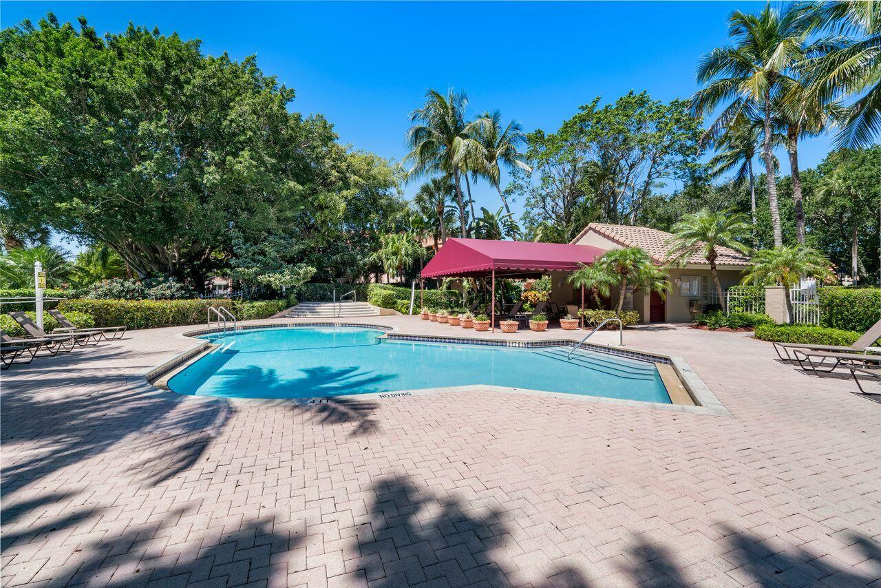 17270 Boca Club Boulevard, Unit 1707 Boca Raton, FL 33487 - Photo 55 of 68 a view of outdoor space with yard and swimming pool